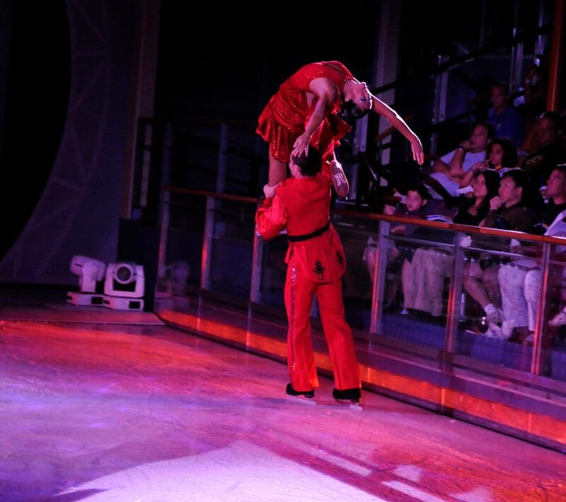 Taylor Grant ice skating with partner on Royal Caribbean Cruise.