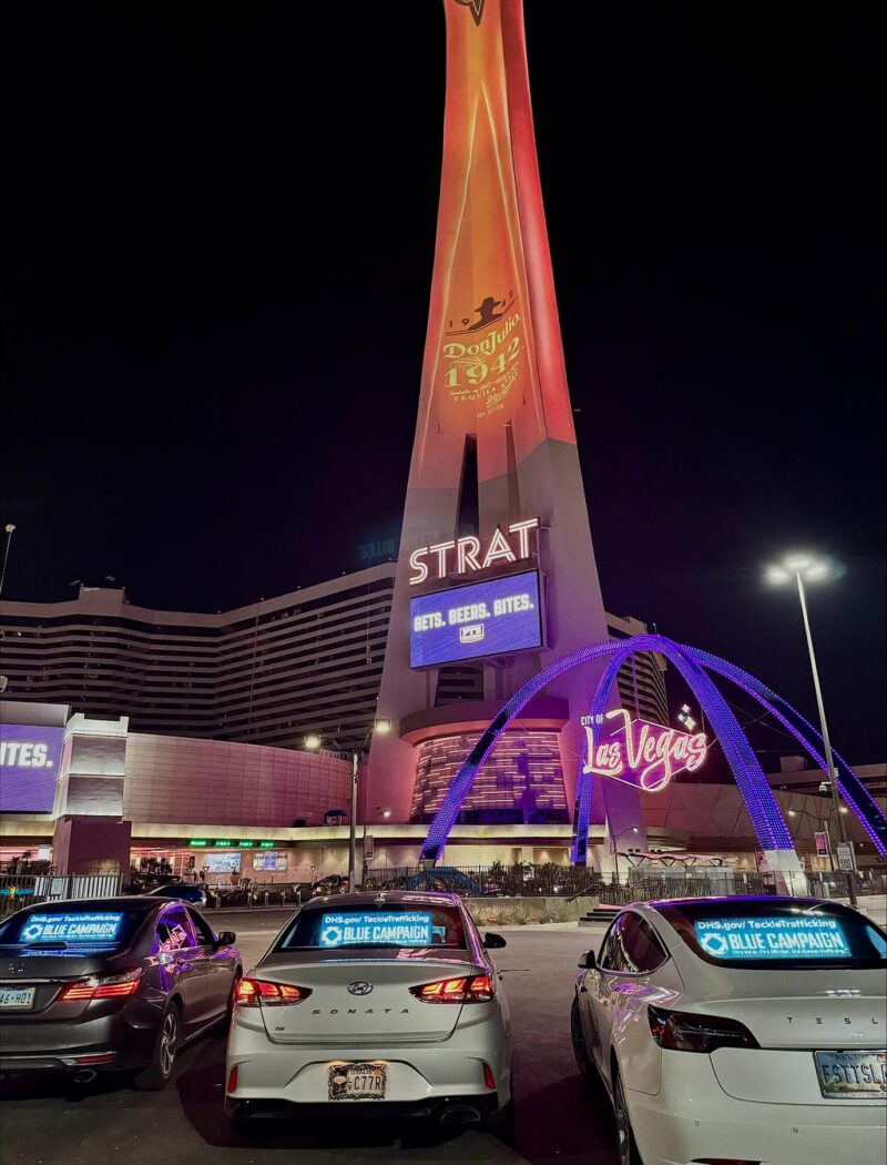 Cars show the Blue Campaign digital ads in their rear view windows parked outside the Strat in Las Vegas