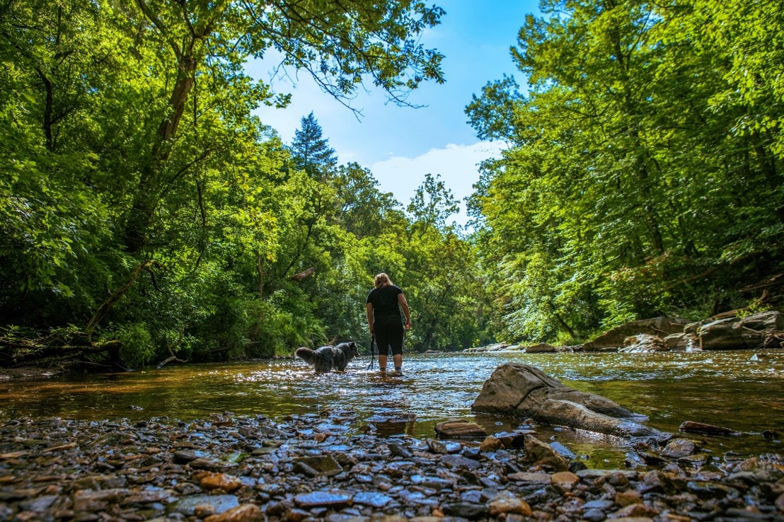 Kylie Willet exploring Wissahickon Park with her dog.