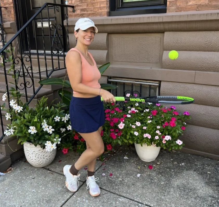 Laura in her tennis gear ready for a day on the court.