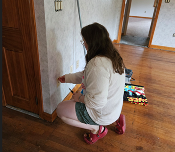 Rachel Martin working on renovations in her new home during week one of the Summer Wellness Series.