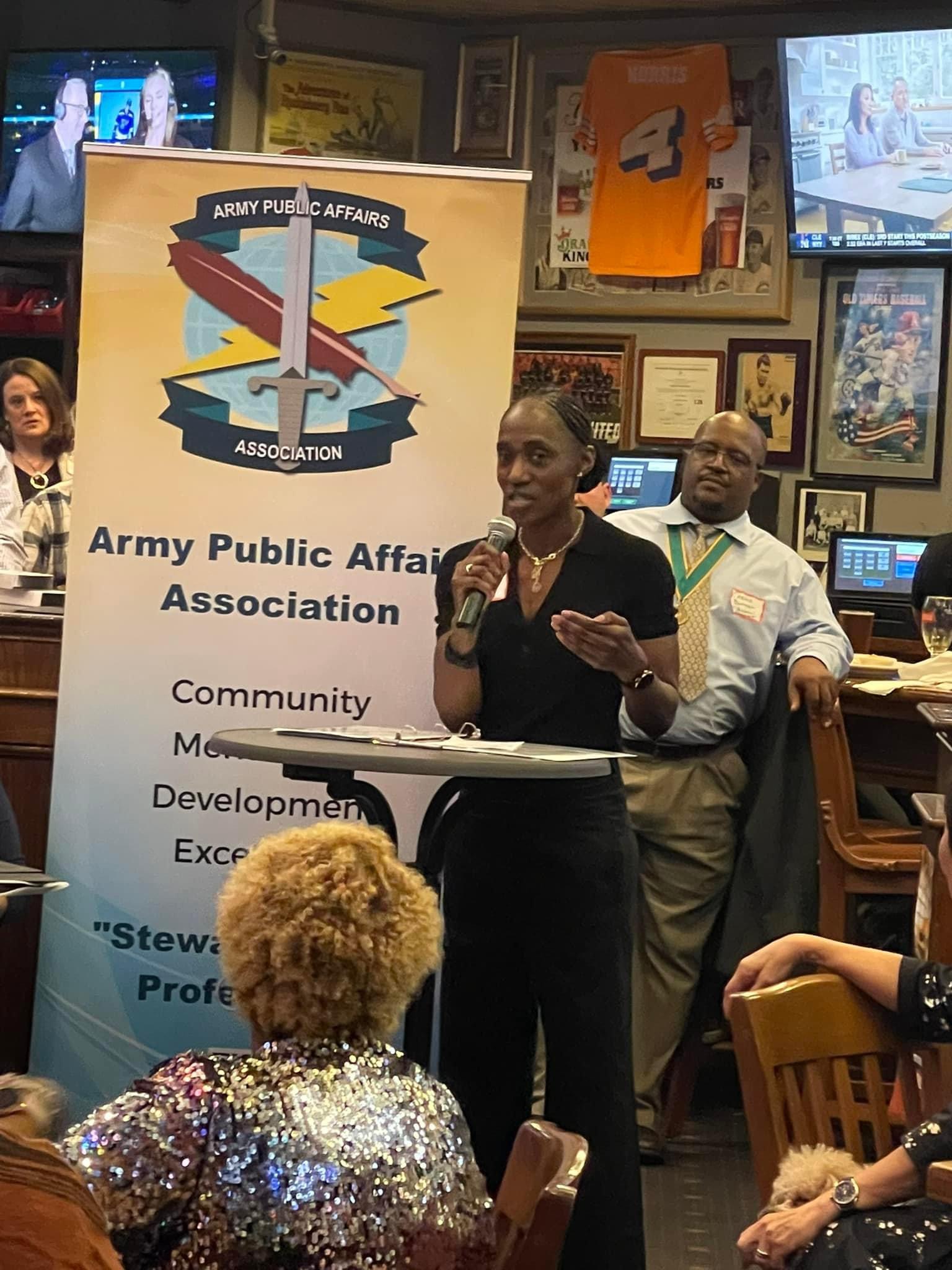 Amanda Azubuike, Army Chief of Public Affairs, addresses the assembled members of the Army Public Affairs Association on the Don Carr Memorial Scholarship Awards.