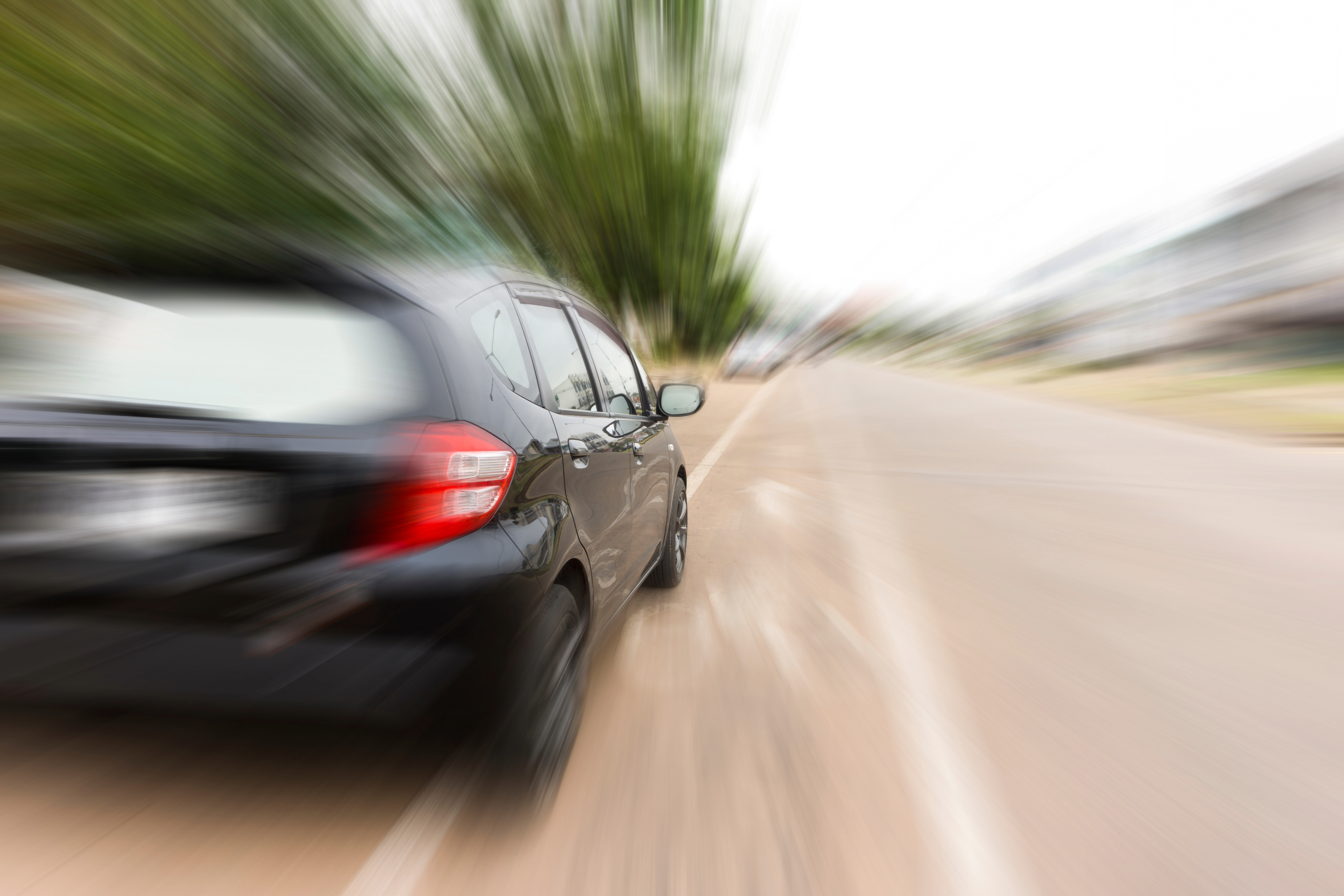 Image of a car speeding.